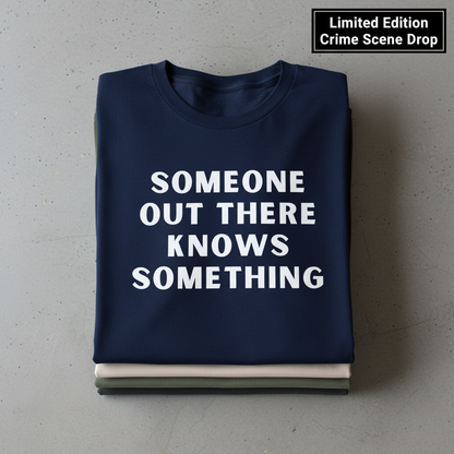 Someone Knows Something T-Shirt_stacked_flatlay